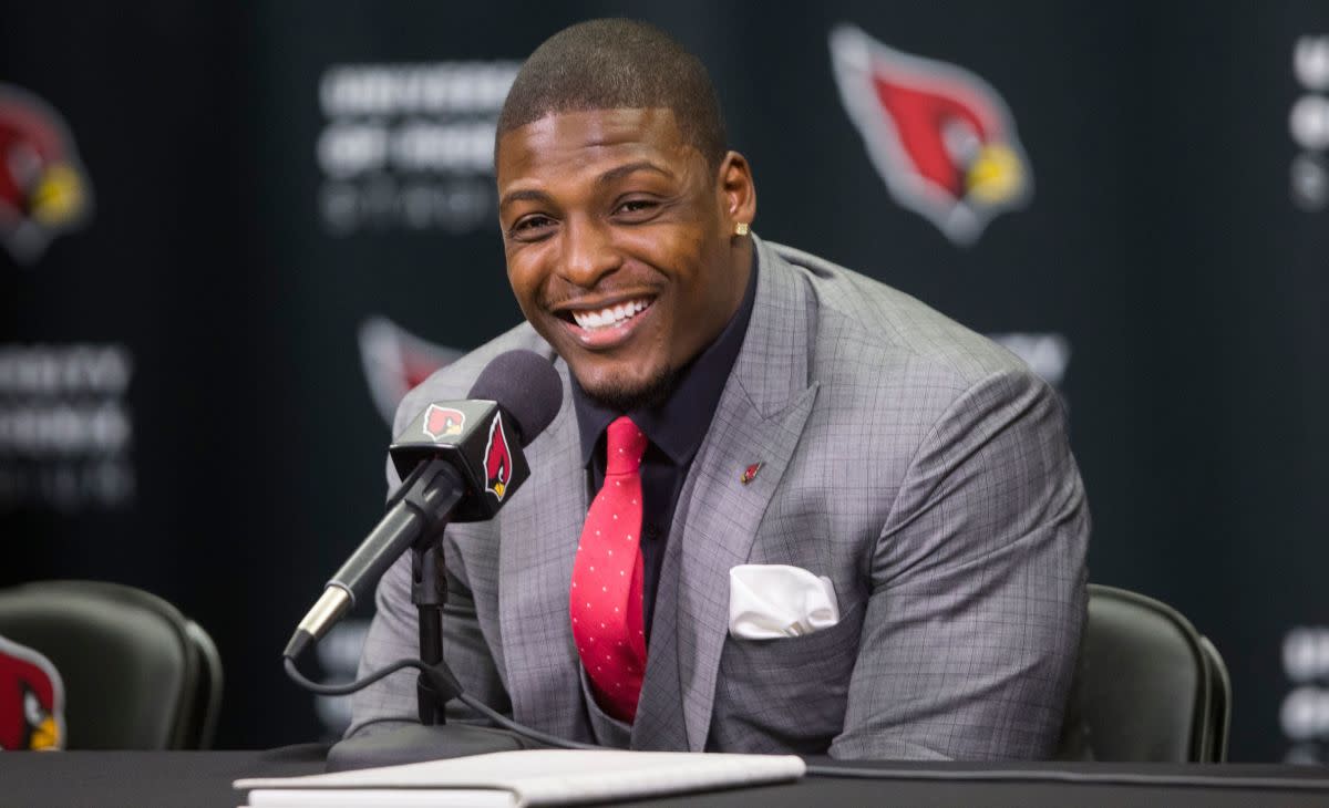 Adrian Wilson announces his retirement after signing a contract with the Cardinals at the Cardinals Training facility in Tempe on April 18, 2015. 